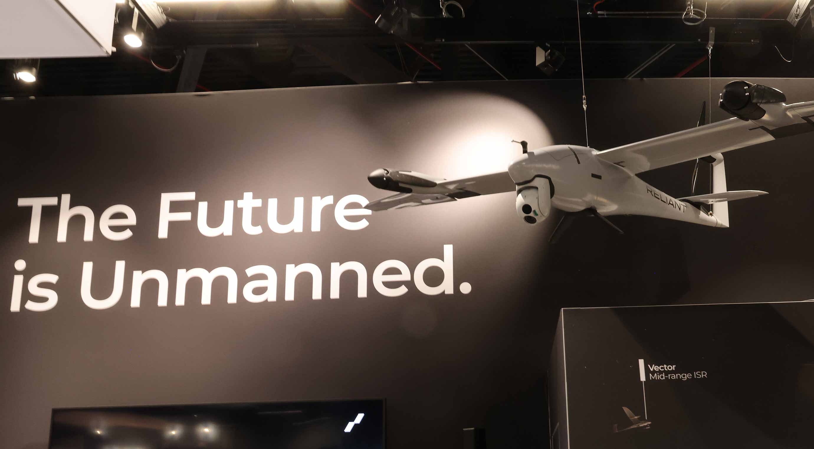 Drone hovering over an exhibition stand with the slogan ‘The Future is Unmanned’.