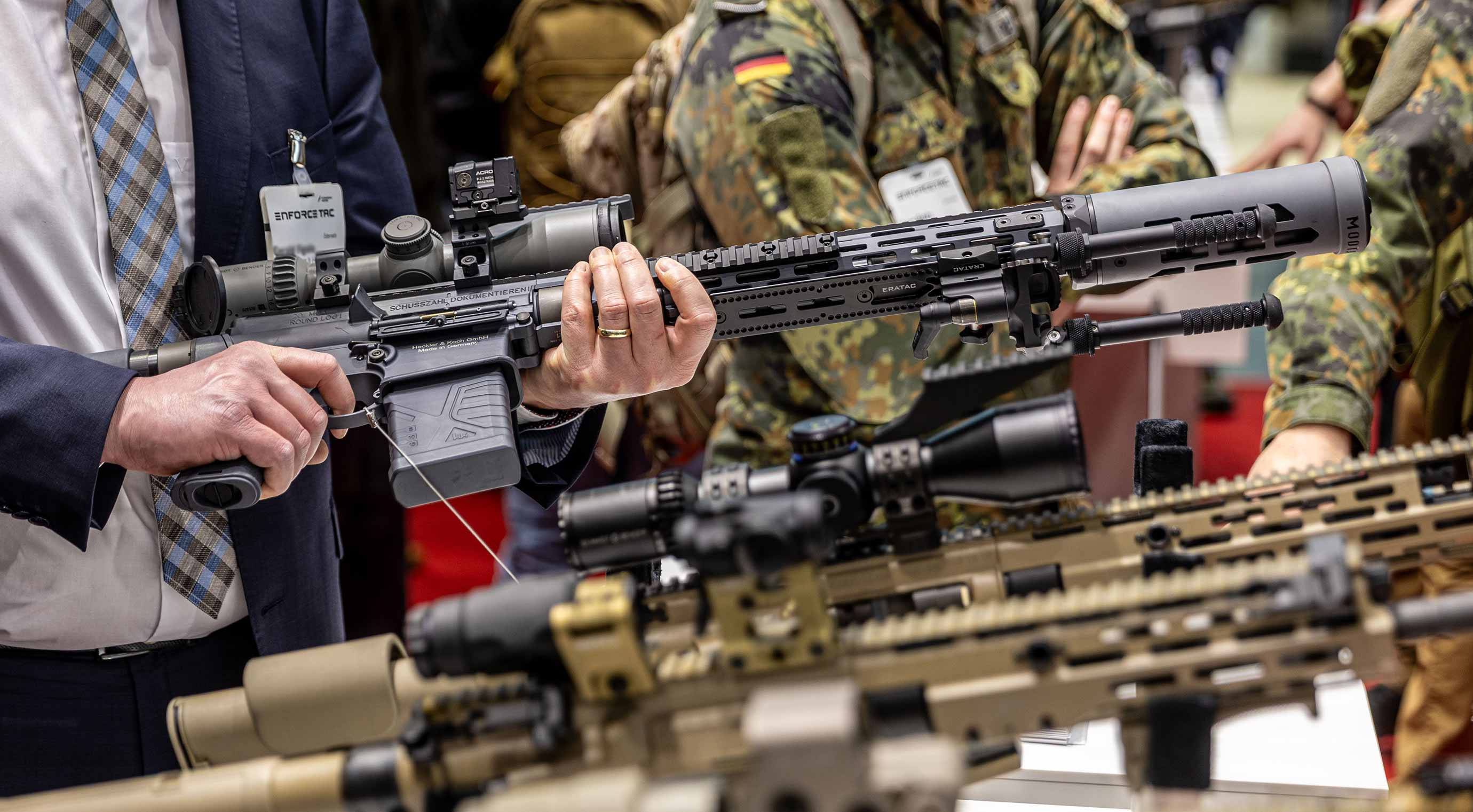 Display of long guns fitted with telescopic sights at the exhibition stand.